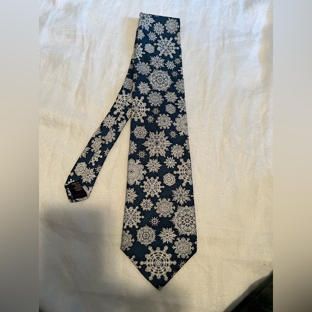 The Museum of Fine Arts, Boston tie in snowflakes. Teal and white.